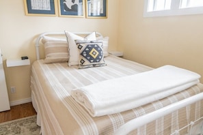 Queen bedroom with desk and roku tv