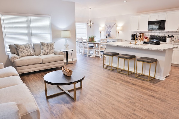 Very nice and spacious living room with a new couch and loveseat