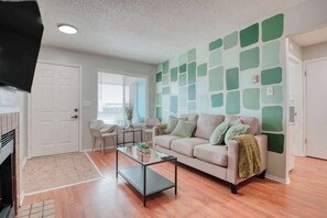 This space is perfect for lounging or entertaining. The indoor fireplace adds warmth and ambiance, while a smart TV ensures you stay entertained with your favorite shows and movies.