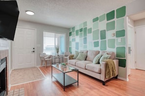 This space is perfect for lounging or entertaining. The indoor fireplace adds warmth and ambiance, while a smart TV ensures you stay entertained with your favorite shows and movies.