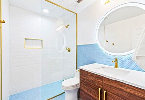 Brightly Lit Bathroom with Colorful Accents in the Upstairs Bathroom with Anti-Fog Mirror