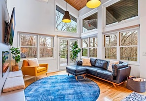 Colorful Living Room with Large Open Windows for Plenty of Natural Light