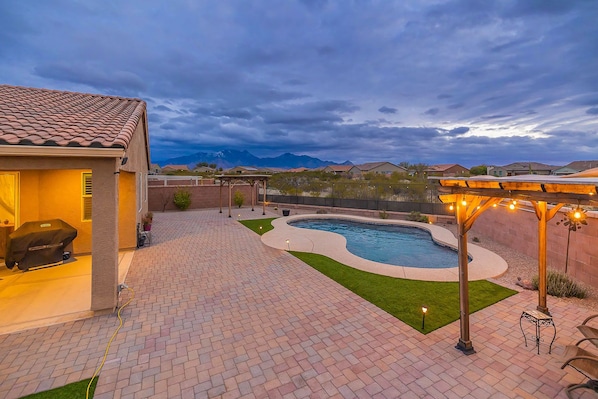 Backyard oasis with two pergolas