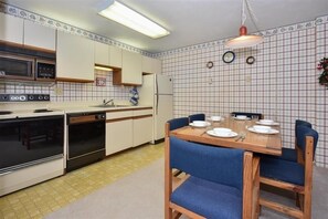 Indoors, Kitchen, Refrigerator, Dining Table, Furniture