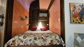 Master bedroom discreetly hidden behind barn doors.