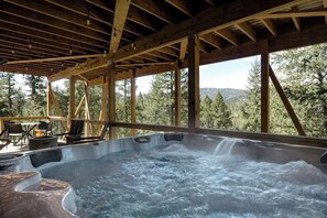 Hot tub with dimming patio lights and stunning panoramic views of Shadow Mountain.