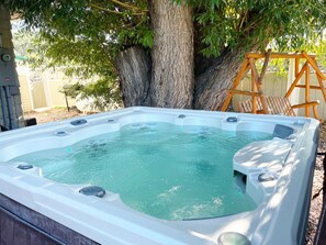 Indulge in the soothing warmth of a hot tub after a day of exhilarating hiking.