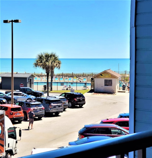 The view of the beach and pool from  the balcony, less then 100 yards from it.