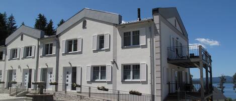 Sky, Building, Window, Cloud, House, Urban Design, Facade, Roof, City, Asphalt