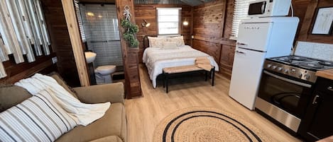 Rustic cabin with aged, corrugated metal ceiling