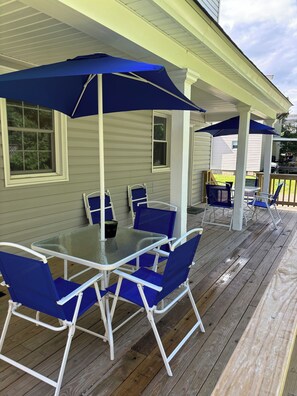 Shared outdoor patio, each side has own table and chairs.