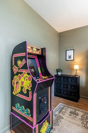 Our second bedroom with queen bunk beds, and arcade game for some late night (or early morning, fun!)