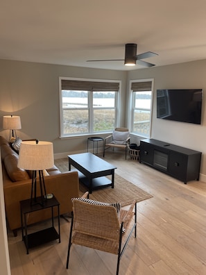 Living room with view of the sound. Charter TV is available.