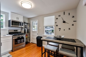 kitchen with hightop table that seats 4