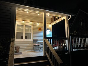 Covered seating nook at night.