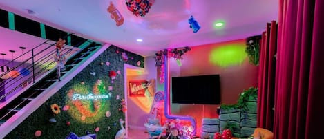 Rank One Stays invites you to step into a Willy Wonka Themed Airbnb, where vibrant colors infuse every corner with joy. A whimsical and delightful retreat suitable for guests of all ages!