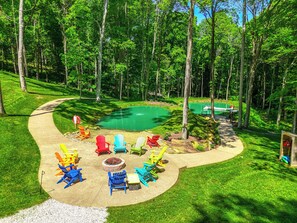 There is a beach off the fire pit area.  Starter firewood is provided.