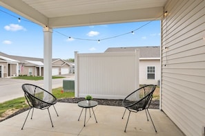 Outdoor walkout patio with seating for 2