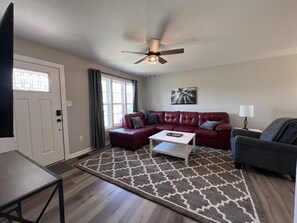 Spacious living room with 50" smart TV