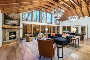 Cozy up to the fire in the living room with vaulted ceilings