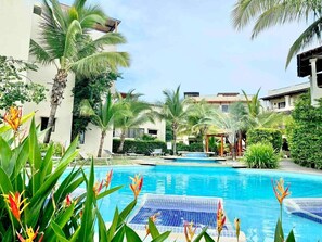 The back door of the condo leads out to this pool and rancho area