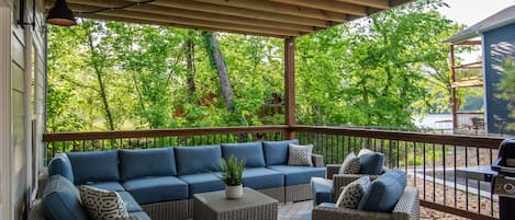 Patio with lake view and bbq grill