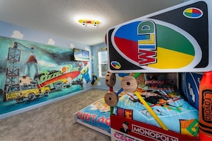 Dive into a playful adventure in this vibrant theme room, perfect for kids and families seeking a unique stay!