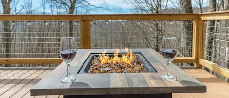 Relax at the fire pit at Hill House Cabin