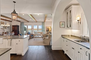 View from Foyer to Kitchen Island, Bar and Den--with stunning river views