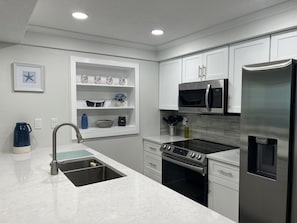 Fully equipped kitchen with a Kurig coffee maker, all new appliances.