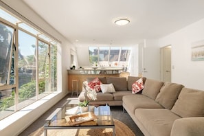 Living area with big windows overlooking Mt Drury Park