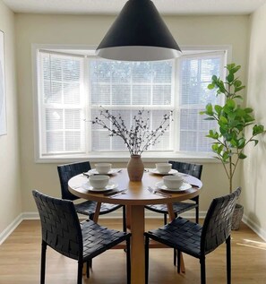This classic breakfast nook is simple and inviting.  Envision yourself and your loved ones sharing a meal, a story, or a game - catch up as you reunite; or plan as you get ready to explore Savannah!