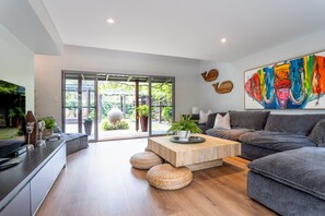 Relax in this casual lounge that opens to a vine-draped courtyard, ideal for board games, movies, or simply basking in the quiet.