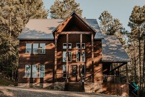 Discover the magic of cabin living surrounded by trees.