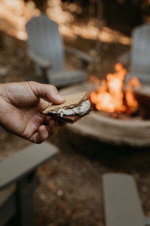 Creating delicious experiences one s'more at a time by the firepit.