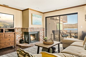 Floor-to-ceiling sliding glass doors in the living area