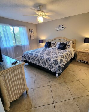 Master bedroom with a king size bed and bathroom