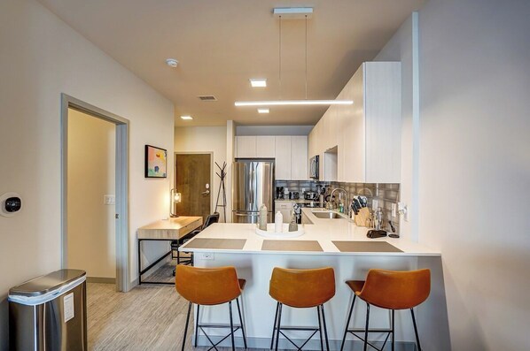 Make yourself at home in our beautifully designed bar top dining room with an amazing kitchen. 