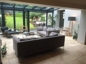 Fan fold doors leading from the sitting room to the garden