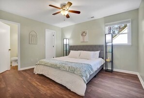 Master bedroom with king size bed and spacious walk-in closet.