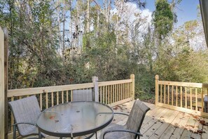 Secluded back porch with BBQ grill right off the kitchen.