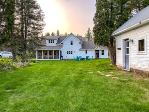 The backyard in the spring. There is a lot of room to roam!