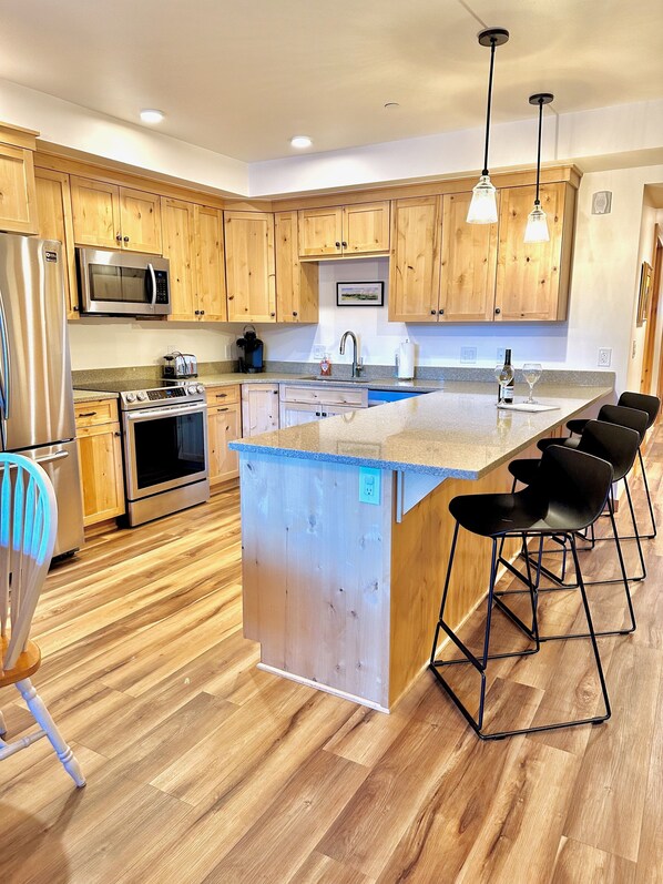 Kitchen with peninsula facing great room.