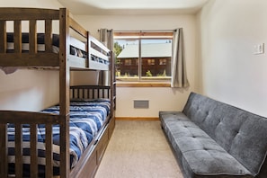 Bunk room looking East. Twin bunks, trundle and fold flat futon.