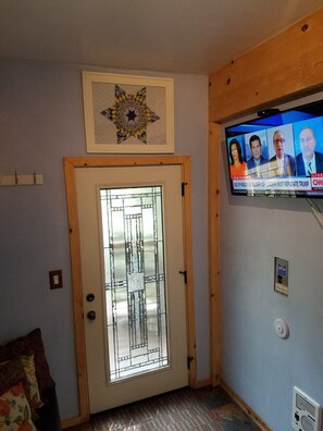 Leaded glass door, blinds for use at night.