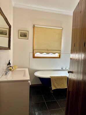The Bathroom including castiron claw foot bath and large single shower.