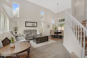 Front door entrance to first living room. Power reclining sofas! Games in table.