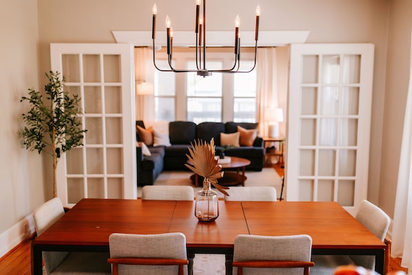 Seamless dining and living: this dining area is perfectly positioned across from the living area, creating a harmonious space for entertaining and relaxation.