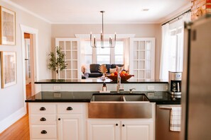 The full kitchen with farmhouse sink is sure to bring out your inner chef.