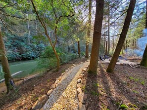Stroll the path along the banks of the creek at this luxury cabin rental